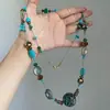 Colar de borla com contas florais azuis de alta qualidade para mulheres, um choker único para usar em camadas, corrente de clavícula chique e versátil