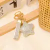 Llavero Colgante Popular Estrella de Arcilla Transfronterizo con Pedrería, Cordón de Cuero y Accesorios de Metal para Bolsas de Coche