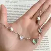 Collar de Cadena Irregular con Perlas de Amor Transparente para Niña Estilo Chanel de Gama Alta Nicho Cadena para Clavícula Versátil