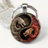 Llavero Dragón Yin y Yang-Colgante de aleación de moda, diseño complejo de dragón blanco y rojo, muy adecuado