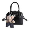 Bolsa de Mão Elegante Texturizada de Cor Sólida Formato de Concha Feminina 2026 Nova Tendência Bolsa de Ombro Fashionable Retro Bolsa Transversal