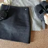 Falda midi de lana de color liso de alta gama para mujer 2026 Otoño/Invierno Nuevo Estilo Coreano Simple Versátil de línea A que se ajusta a la cadera