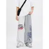 Pantalones de chándal holgados de pierna ancha con estampado de letras, estilo casual americano, para unisex, color gris, con cordón, hasta el suelo, de moda