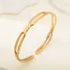 Pulsera trenzada de acero inoxidable simple Tohm de venta caliente transfronteriza para mujer, pulsera abierta de lujo ligero retro de alta gama al por mayor