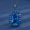 Outono e inverno novo joias Huabi cobre banhado a ouro simulação corindo vermelho cristal azul afiado temperamento terno preto dourado 12*16