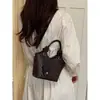Bolsa de alta qualidade com padrão trançado de nicho para mulheres, nova moda 2026, bolsa transversal versátil, bolsa de mão requintada, bolsa tipo saco