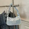 Bolsa feminina tipo baguette de ombro 2026 verão nova nicho renda plissada doce e cool estilo patchwork pequena bolsa de ombro
