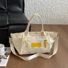 Bolsa de lona transfronteriza para mujer, bolsa de gran capacidad para el día a día, nuevo bolso de mano casual versión coreana para el verano 2026, bolso de hombro y cruzado
