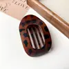 Nuevo Clip de Tiburón Curvo Elegante de Disco Plano Ovalado Nuevo para el Cabello Trasero Pinza para el Cabello con Diseño de Arco