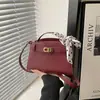Moda Nova Primavera 2026 Lenço de Seda de Alta Qualidade Bolsa de Mão Versátil Elegante Textura Simples Ombro Único Transversal Bolsa Kelly
