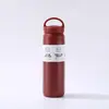 Taza elemento de acero inoxidable 304 para estudiantes, taza aislada de alta estética para hombres y mujeres, botella de agua portátil para exteriores con asa, venta al por mayor desde el fabricante