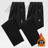 Pantalones casuales gruesos con forro polar para hombre, pantalones deportivos de otoño e invierno, corte holgado, versátiles, pantalones rectos con puño, pantalones largos para hombre