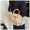 Bolso de Mano Simple de Color Sólido Estilo Coreano Bolso Tipo Concha para Mujer Primavera 2026 Nuevo Bolso de Hombro Cruzado de Moda de Nicho de Alto Valor