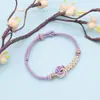 Pulsera tejida a mano de ocho hilos con mandala de flor de durazno 2026, hilo rojo semiacabado, pulsera de hilo rojo ajustable