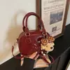 2026 Bolso Beta Texturizado Nuevo Bolso Pequeño de Bolos Bolso de Mano de Nicho Bolso Almohada Boston para Mujer