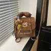 Coleção Outono/Inverno 2026 Transfronteiriça: mochilas infantis, com designs combinando para pais e filhos, com padrões de desenhos animados bordados, mochilas pequenas estilosas e requintadas