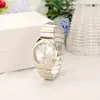 GREALY reloj de pareja impermeable de cruz caliente transfronterizo TEMU reloj de cuarzo con correa de acero para hombres y mujeres fabricantes de relojes de moda al por mayor
