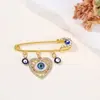 Broche de Borla Olho de Diabo Cravejado de Diamantes Criativo Europeu e Americano, Broche de Estilo Frio para Suéter de Cintura com Olhos Azuis de Alta Qualidade
