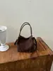 Bolso tipo cubo tote de alta gama transfronterizo, elegante, para mujer, nuevo diseño retro, estilo nicho, adecuado para ir al trabajo, se puede llevar como bolso de hombro o bolso cruzado, moderno