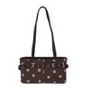 Bolso tipo baguette de lunares con diseño de nicho estilo coreano para mujer, nuevo modelo de verano 2026, bolso de hombro y axila de gran capacidad con hebilla de cinturón