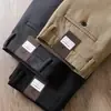 Pantalones casuales rectos de algodón modal refinado suave y cómodo de cintura media elástica para otoño e invierno, color caqui, de alta gama, ropa formal para mediana edad