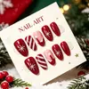 30 piezas de uñas postizas con temática navideña con rayas rojas y blancas, gorros de Navidad y copos de nieve, en color rojo vino, puntas de uñas de moda y desmontables