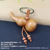 Madeira de pêssego bolsa da sorte corajosa Buda Guanyin elefante auspicioso chaveiro pingente escultura em madeira chaveiro para carro pingente de joia presente