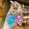 Llavero de Caracola Relleno de Aceite Lindo Llavero de Botella de Arena Líquida Colgante para Mochila Muñeco Máquina Regalo Pequeño para Estudiante Venta al por Mayor