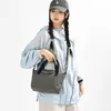 Bolso cruzado pequeño para mujer 2026 nuevo modelo casual ligero impermeable nailon bolso de mano simple bolsa pequeña de albóndiga