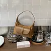 Bolsa de Ombro Única para Deslocamento Transfronteiriço 2026 Nova Pequena de Nicho Bolsa Dumpling Bolsa Transversal Fashionável Estilosa Tendência Textura Bolsa de Axila
