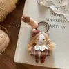 Ins Coreano Nuevo Color Café Tela Muñeca Niña Colgante Lindo Fieltro de Lana Llavero Colgante para Bolso para Mujeres