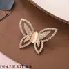 Broche de Piedra Ojo de Gato, Accesorio de Nicho de Alta Gama, Versátil y Creativo, Pin de Solapa Elegante para Moda Femenina, Broche Elegante Incrustado con Diamantes