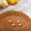 Pendientes de Borla de Perla de Circonita de Aguja Plateada Pendientes Largos de Mariposa de Lujo Accesible Francés Pendientes de Diseño Versátil para Mujer