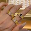 Anillo con forma de huevo de paloma con cordón explosivo y libro de equitación roja para mujer, estilo vintage antiguo de mediana edad, con diamantes brillantes y cuentas anchas, anillo de corte de viento.
