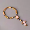 Pulsera de Rosario con Colgante de Cruz de Cuentas de Madera Natural 8mm Cuentas de Madera de Pino Cuerda de María Trenzada Cruz de Pascua Joyería Transfronteriza Venta al por Mayor