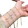 Venta al por mayor de fábrica pulsera de jade de espuma de agua natural roja de departamento pequeño diseño de rosquilla plata s925 incrustada nuevo diseño chino de lujo ligero