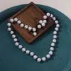 Venta Caliente Europea y Americana Lujo Ligero Alto Sentido del Diseño Perla de Imitación Hecho a Mano con Cuentas Lazo Collar Pulsera Conjunto de Dos Piezas