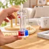 Llavero creativo acrílico cilíndrico con aceite y arena líquida flotante, lindo colgante de coche