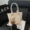 Bolso Cubo Portátil de Color Sólido Simple para Mujer 2025 Primavera Nuevo Moderno Casual Versátil para el Día a Día Bolso de Hombro Cruzado
