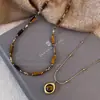 Collar Maillard Otoño e Invierno Piedra Ojo de Tigre Acero de Titanio para Mujer Diseño Coreano de Nicho Cadena Larga para Sudadera Accesorios Versátil Nuevo Estilo