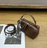 Oubena Mini Bolsa Pequeña Bolso de Mujer 2025 Otoño e Invierno Nuevo Estilo Bolso de Mano Cuadrado Pequeño Bolso de Hombro Cruzado Elegante de Alta Gama