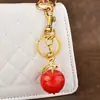 Venta Directa de Fábrica Personalizada Transfronterizo Nuevo Modelo Llavero de Manzana Colgante para Bolso Accesorios para Bolsos de Mujer Llavero de Coche Exquisito
