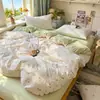 Nuevo juego de cuatro piezas jacquard teñido en hilo de alto peso, estilo simple y fresco, ropa de cama estilo princesa de lujo ligero