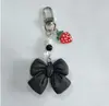 Ins Nuevo Acrílico Lazo Llavero Colgante Distintivo Diy Bolsa Bolsa Colgante Cadena Colgante para Audífonos Joyería