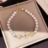 Pulsera de perlas con lazo de doble capa estilo vintage francés, diseño único y versátil, joyería de lujo ligero y de alta gama