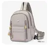 Mochila feminina casual da moda, cor sólida simples, tendência, com múltiplos bolsos para o dia a dia, bolsa escolar de tecido Oxford