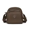 2025 Nuevo Estilo Bolso Cruzado de un Solo Hombro Bolso de Mujer Moderno Ligero Gran Capacidad Multicapa Bolso Pequeño de Viaje para Mujer Bolso de Hombro de Lona