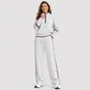 Conjunto esportivo casual popular transfronteiriço europeu e americano para mulheres, com moletom com zíper e gola semi-alta e calça longa larga solta, conjunto de duas peças