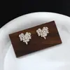 Brincos de Zircônia Qingxing Estilo Coreano Moda Brincos Femininos Personalizados Versátil Floco de Neve Amante da Luz da Lua Fábrica de Joias Venda Direta