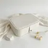 Caja de embalaje para joyería de cuero PU operada de fábrica, caja de joyería larga con botón a presión para uñas postizas, pendientes, collares y joyería, con impresión personalizada